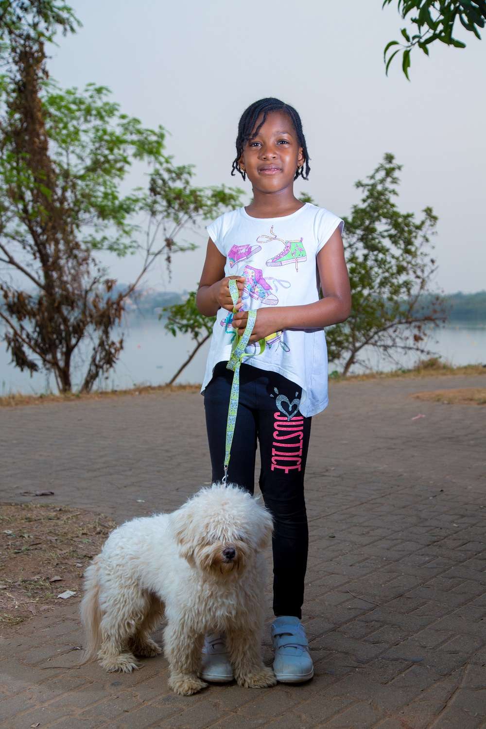 girl-standing-with-dog-on-leash-image-from-tristetix.jpg