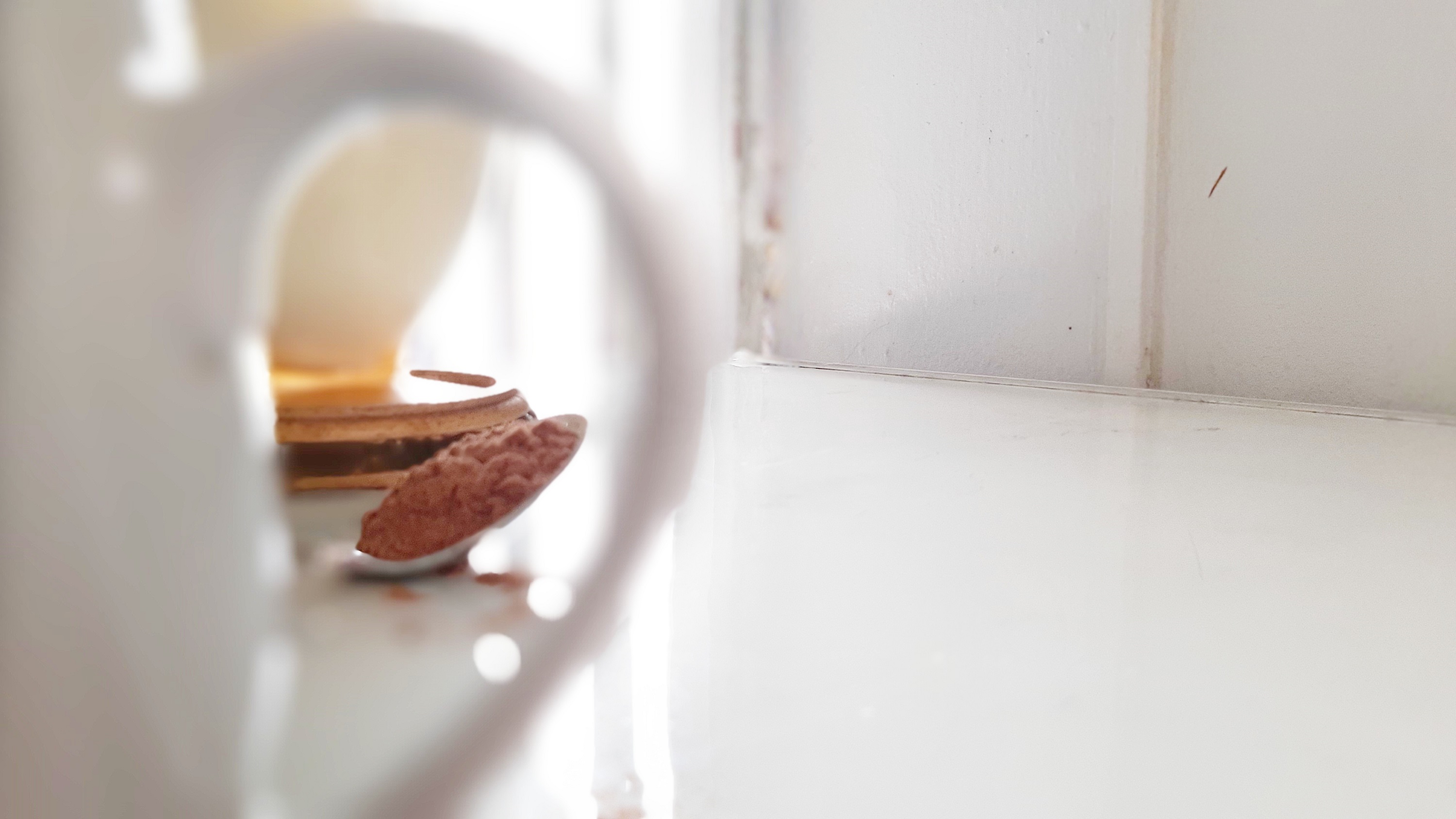 spoon-behind-tea-cup-blurred.jpg