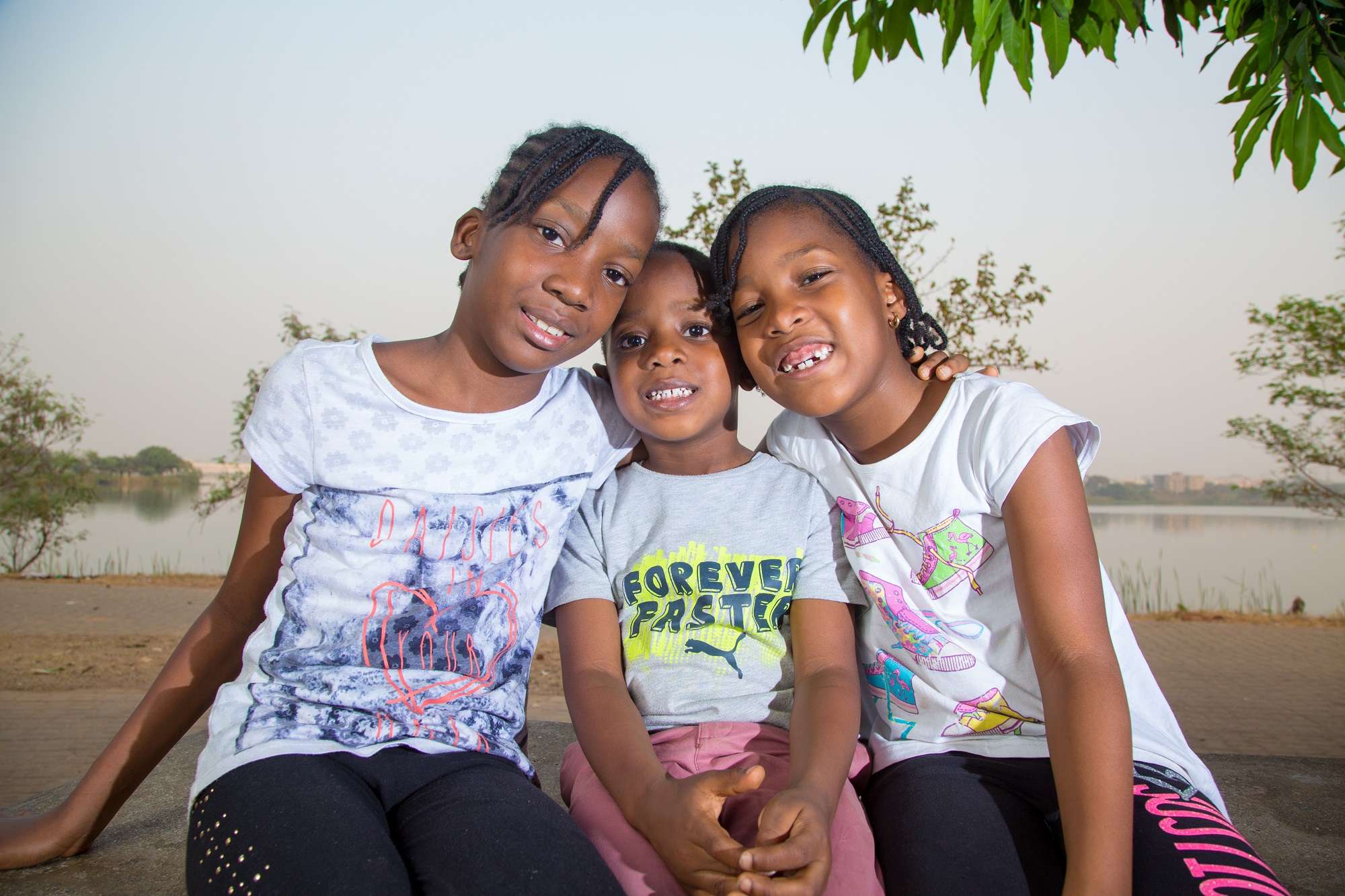 three-children-sitting-smiling-image-from-tristetix.jpg